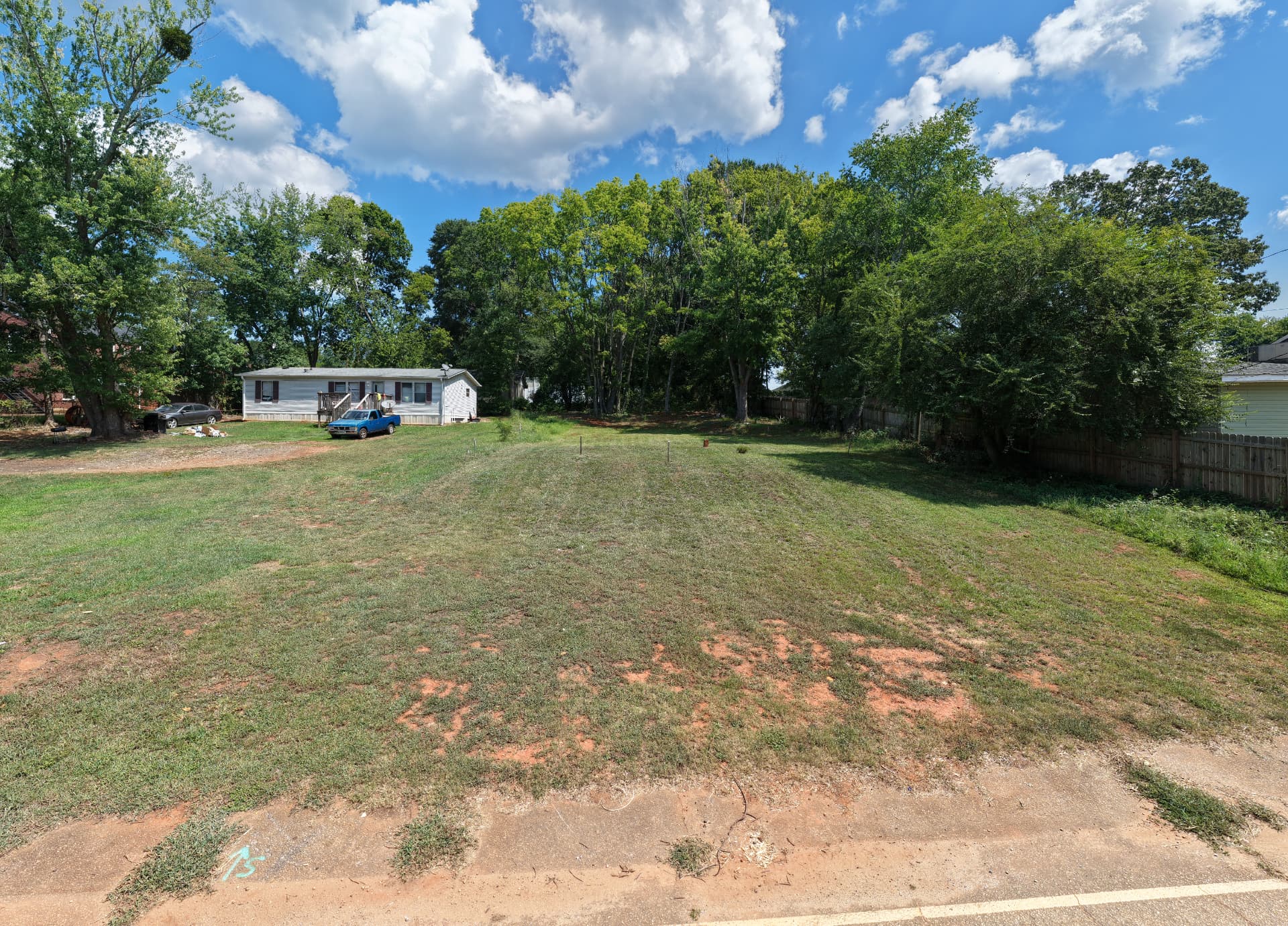 Ground level — cleared, graded, stakes set